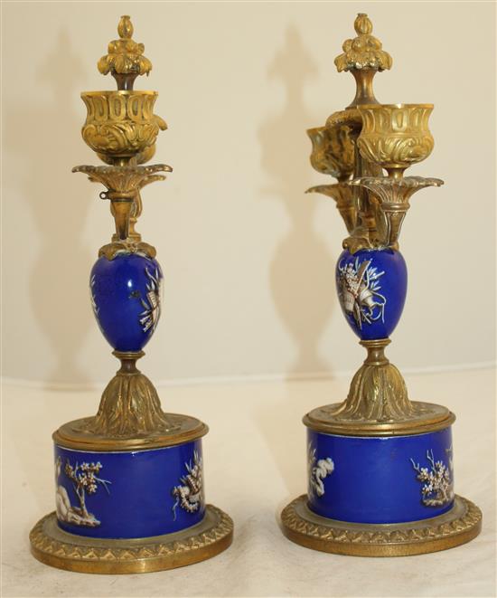 A pair of 19th century French ormolu mounted porcelain candelabra, 10in.